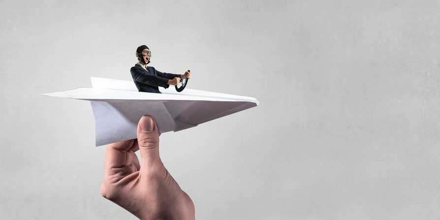 Woman pilot in paper plane. Mixed media